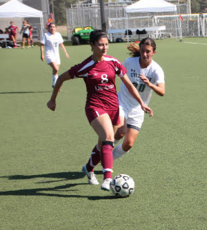 Don's forward Chantalle Sapien evades an evergreen College player during the Dons' match against the Evergreen Hawks on Tuesday, Oct.13.