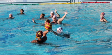 De Anza's Yasemin Memis scans the pool for a teammate to pass to in the Dons 17-2 loss on Wednesday Oct. 21.