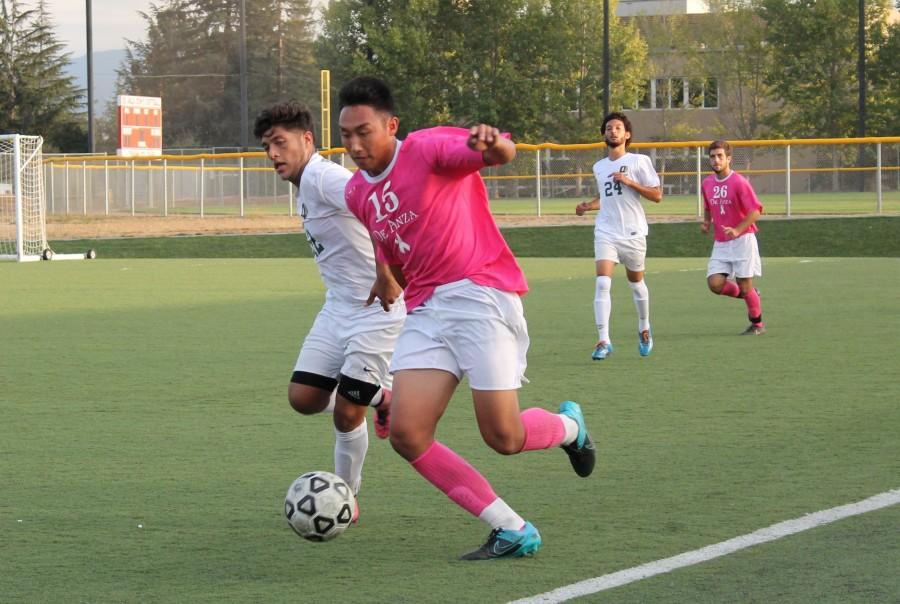 Defender Brandon Hoang (15) blocks an Ohlone defender from a possession in the Dons match against Ohlone college on Friday Oct. 23.