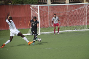  Team captain Connor Kurze (19) clears the ball from an attacking Evergreen striker at De Anza College.