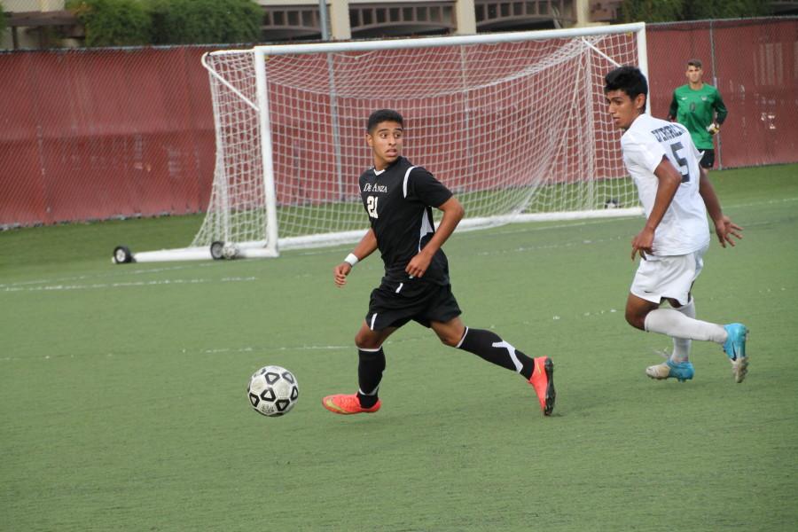 De Anza College forward Alfredo Tinoco (21) scans the field for a play in the Dons Sept. 29 match against the visiting Evergreen Valley College Hawks.