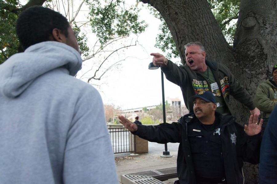 Campus police intervene as De Anza students argue with  preachers from A Cry to God outside the Campus Center Thursday, Jan. 14