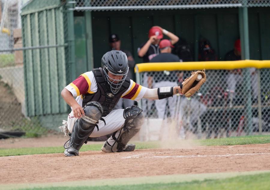 Catcher Rohith Mahanty scoops a bouncing pitch from the dirt in the De Anza College baseball game against San Francisco City College on Thursday, April 7.
