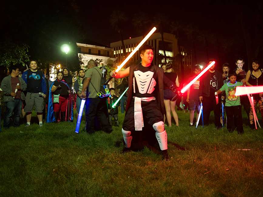 Participants wielding Lightsaber battle clash in a “Cats in Space” event in St. James Park, Downtown San Jose on April 30. 