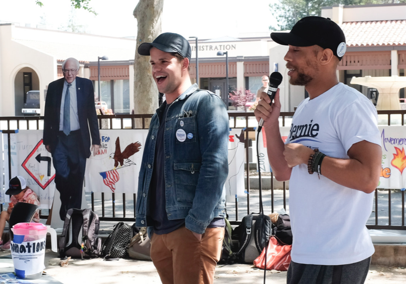 (from left) Actors Max Carver (“How to Get Away with Murder”) and Kendrick Sampson (MTV’s “Teen Wolf”) speak with students about the importance of registering to vote outside the Hinson Campus Center at De Anza College on Thusday, May 12.