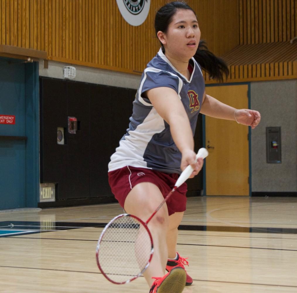 De Anza College badminton player Tiffany Liao reaches low to strike the shuttlecock moments before it hits the ground at the badminton state championship at Mission College on Friday, May 12. Liao lost in the quarter final round.