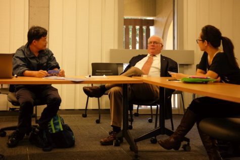 John Swensson, who will be teaching English in Vietnam, explains the details of the trip to a room of interested students on Monday, Oct. 23 at the De Anza library.