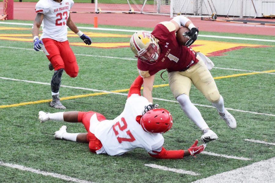 Paul Lomanto stiff-arms a San Francisco defender during a game on Nov. 4. The Dons lost, 58-0.