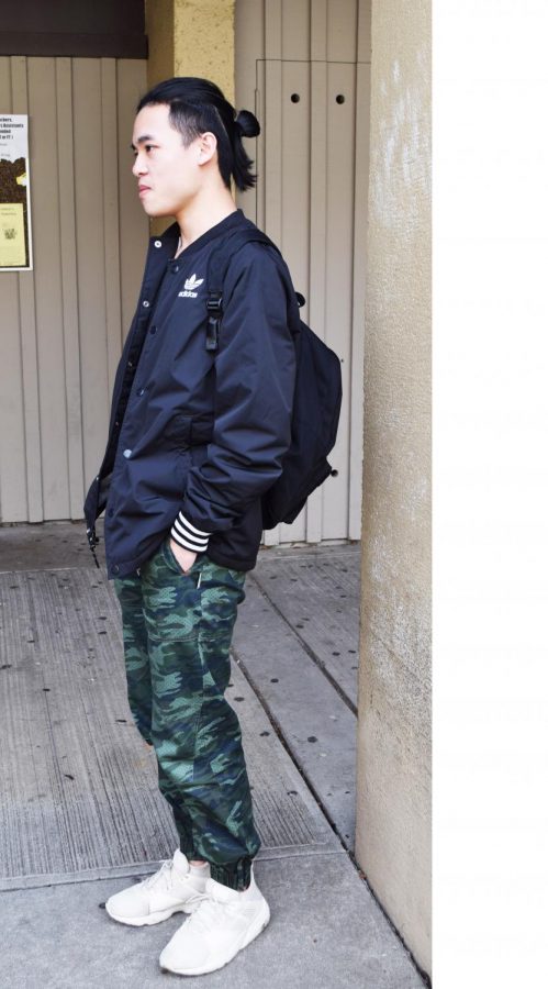  Alen Ho, business major, wears a sport-street look. His camouflage pants contrast with white shoes and black Adidas sport jacket. His final touch for the look is tied hair.
