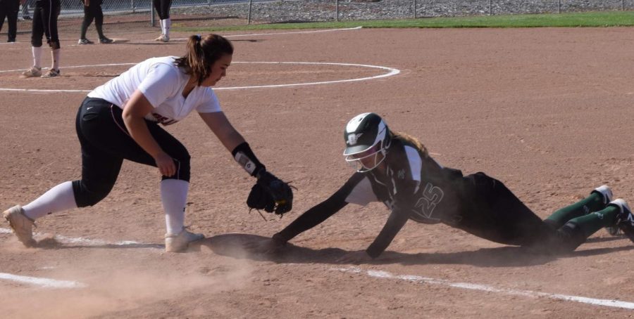 Dons infielder Jolyssa Ramirez attempts to tag out an Ohlone baserunner during their game at De Anza College on April 12