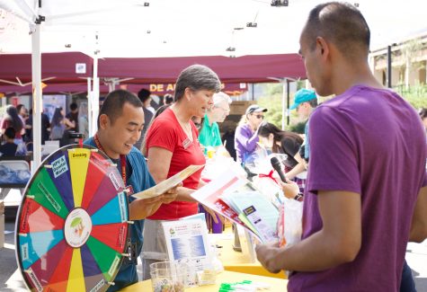 Mary Sullivan, Director of Health Education and Wellness and Gio Supnet , Administrative Assistant Student Health Services 
talk to students on Welcome Day, Sept. 21.