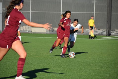 No. 16, Kaylyn Emperador, defense, works with hear team to go for the goal. 