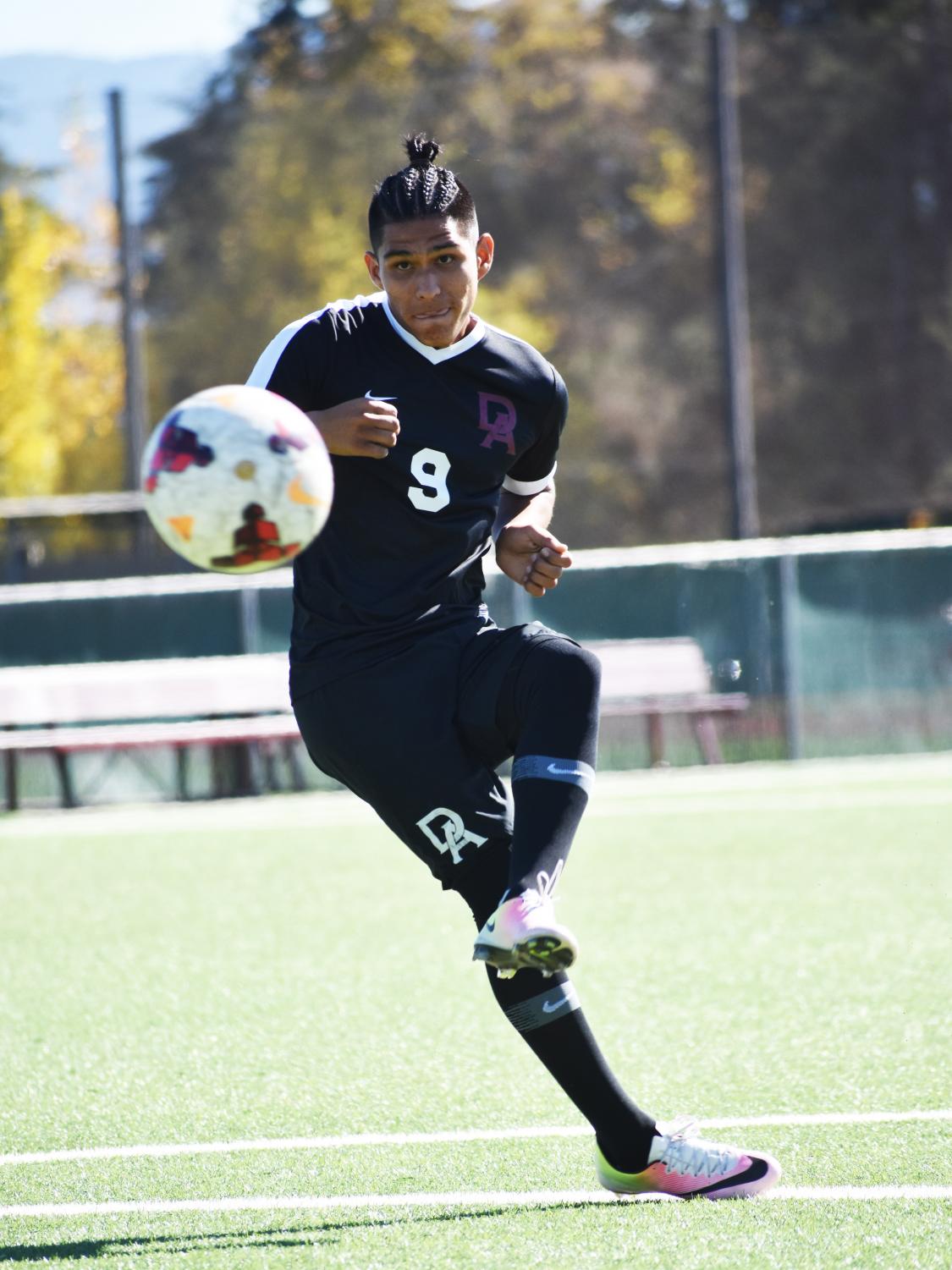 Alex Balleza, 21, kinesiology major, shooting to the goal during practice on Oct. 31 at De Anza College.