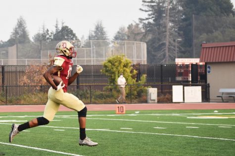 Cortlandt Brooks, 19, engineering major, running for the touchdown during the game that took the team to the state championship on Nov. 10 at De Anza College against Yuba College.