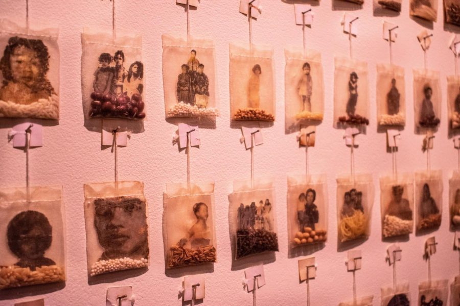 Begins With Tea by Trinh Mai. Made from family photos printed on joss paper, grains, seeds, herbs, and dried noodles from Grandmothers kitchen, Grandmothers used tea bags.