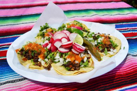 Delicious steak tacos topped with homemade salsa, and crispy lettuce designed to make mouths zing from La Frontera Grill.
