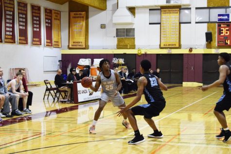 Aaron Tomlinson, 20, psychology major is on Feb. 14 looking to make a pass on Feb. 14 against Cabrillo College.