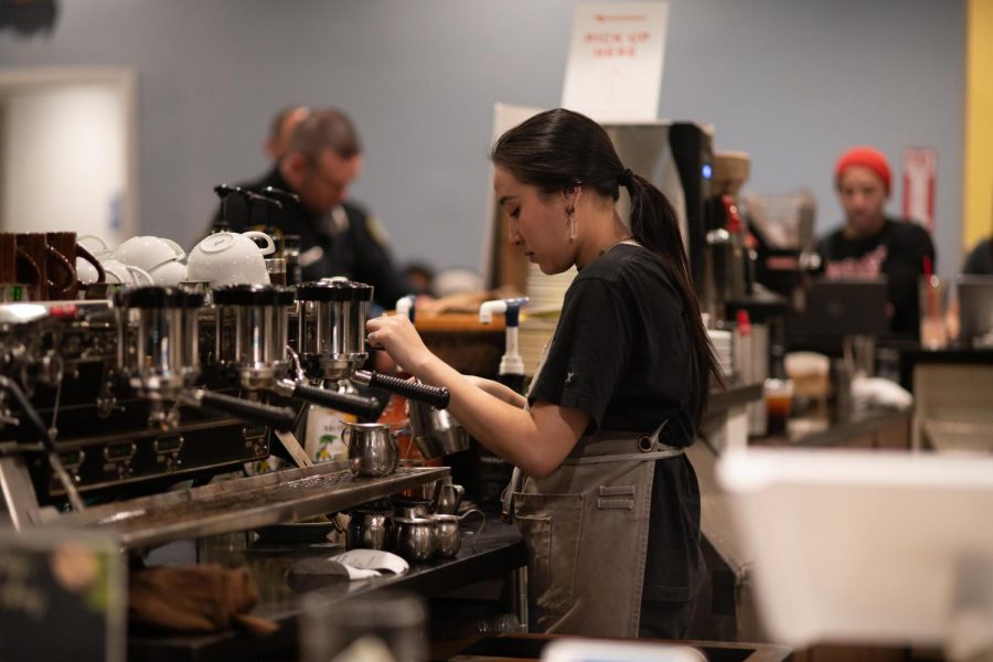 Samantha Tran, 21, biology major prepares a customer’s order at Big Mug Coffee Roaster.