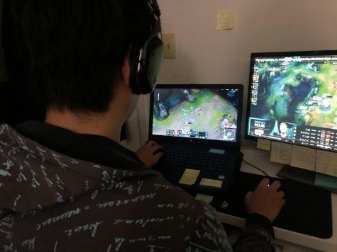 Gamer playing League of Legends while simultaneously streaming the 2020 Champion Series Spring Split Playoffs on Twitch.