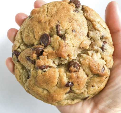 A chocolate pudge cookie with brown butter and chocolate chips