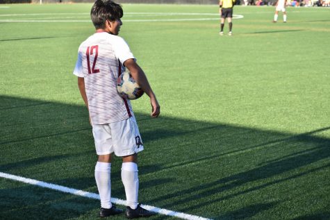 De Anza fullback Jaeson Gonzalez prepares to take a throw-in during the first half of a rivalry clash with Foothill College. 