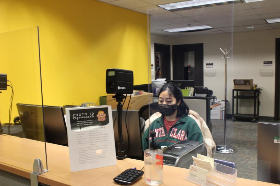 Alyssa Ung is a 26-year-old network programming major who came from the country Malaysia. She is seen here working the Photo ID desk at the Student Services Center.