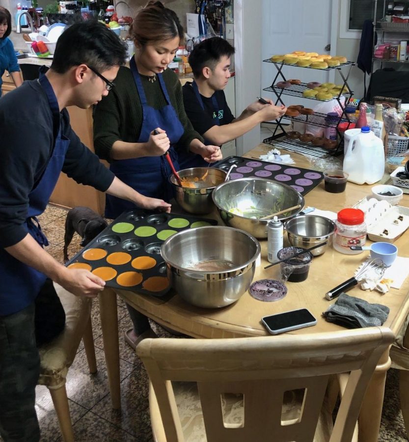 (From left to right) Tu Tran, Sandra Ho and Brandon Pham prepare Mochatas signature donuts at their house in San Jose on Nov. 21. They bake and live together.