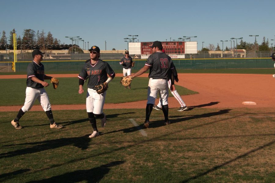 The De Anza infield walk back to the dugout after getting out of the second inning. The Mountain Lions would win a 8-7 thriller on Feb. 1.