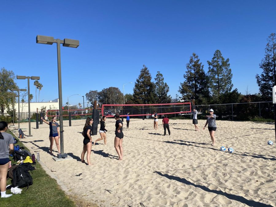 De Anza Volleyball Coach Dawnis Guevara walks her new team through some instruction at their off-campus practice site at Valley Church.