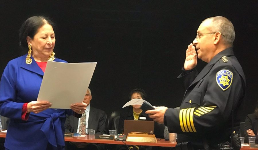 Chief Acosta at his swearing in ceremony with Chancellor Judy Miner in 2018.
