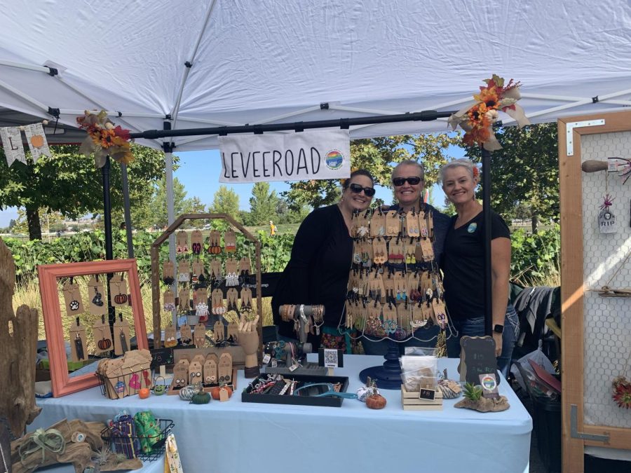 Melissa Dillon, Amy Ingram and Rhuamia Lucero pose with their products for their brand LeveeRoad at San Joses Fall Festival on Oct 1.