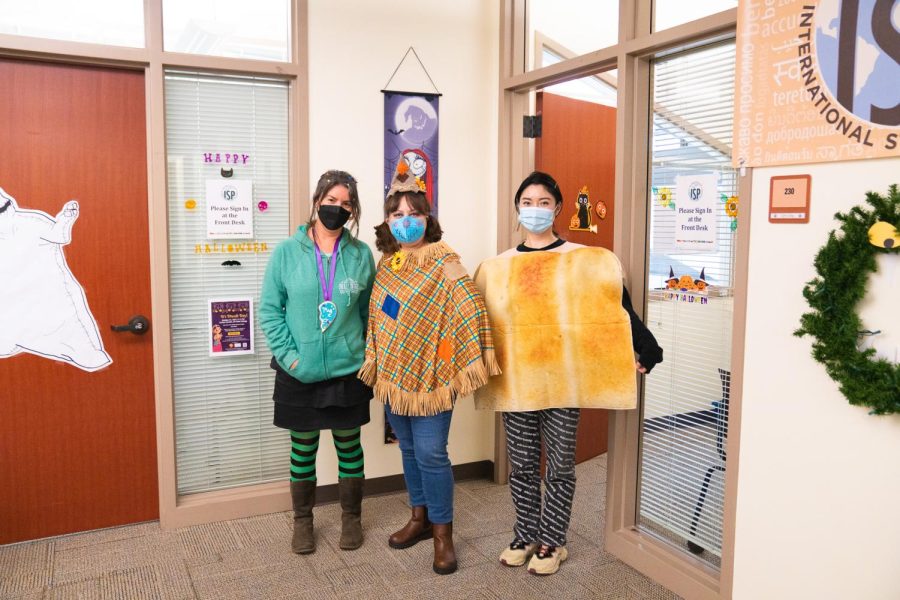 (From left to right) International Student Adviser Allison Largent dressed as Vanellope from Reck-it-Raph, ISP Program Coordinator Angelica Strongone dressed as a scarecrow and ISP program coordinator Lynn Ling dressed as a piece of toast in the ISP offices on Oct. 31.
