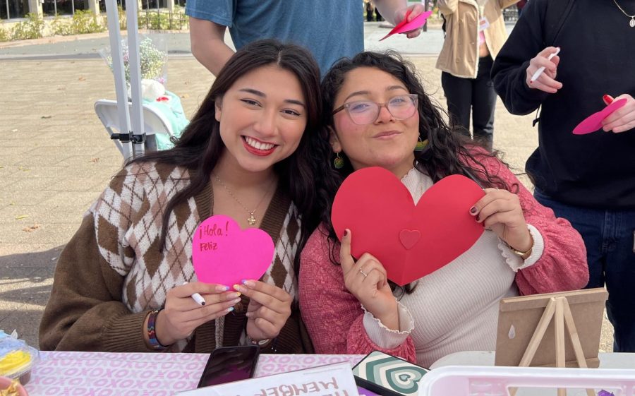 Jennifer Ulloa De La Torre, 18, political science major (left), and Arianna Aguilar, 18, political science major (right), create cards to be showcased in the HEFAS center on Feb. 14.