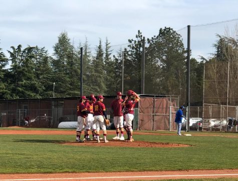 The De Anza baseball team gathers on the mound during its game on Feb. 16.  