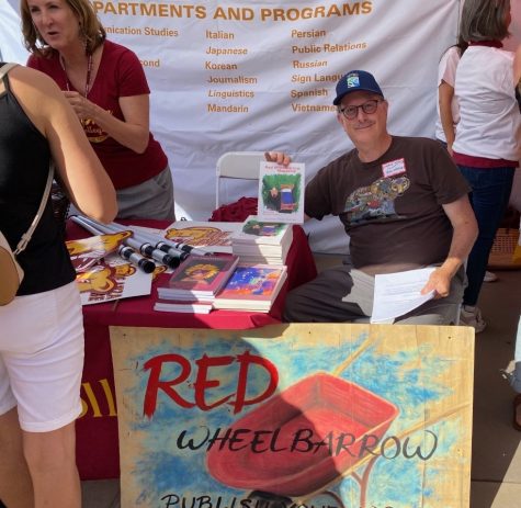 Dean of Language Arts Kristin Skager (left) with Professor Ken Weisner  promoting the Red Wheelbarrow at De Anza Colleges Welcome Day in 2022 (Photo Courtesy by Ken Weisner).