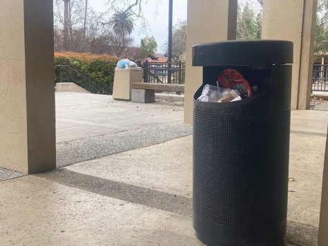 Two full trashcans on the De Anza College campus show the impacts of having a small custodial staff.