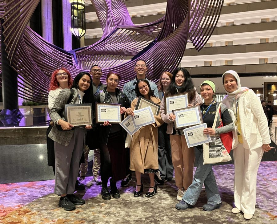Current and former La Voz News staff members along with the adviser (right) show off their awards at the Spring National College Media Conference held at the Hyatt Regency Hotel in San Francisco on March 11. 