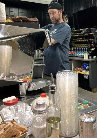 Jared Forman makes a drink at Power Cup Coffee on May 24. He has been the shops owner since 2011.