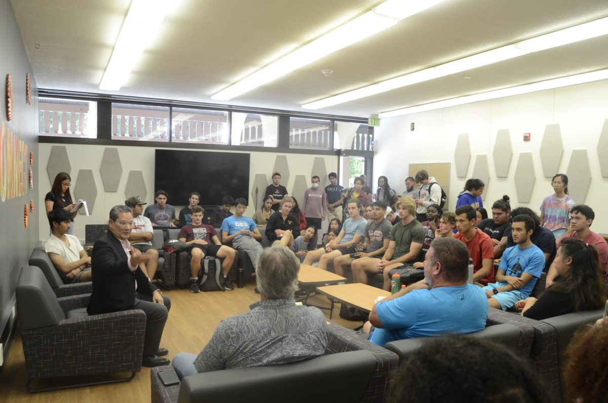 Track and field students and coaches meet up with Chancellor Lee Lambert to talk about the lack of communication over the firing and suspension of three coaches on Sept. 27 at room L47.