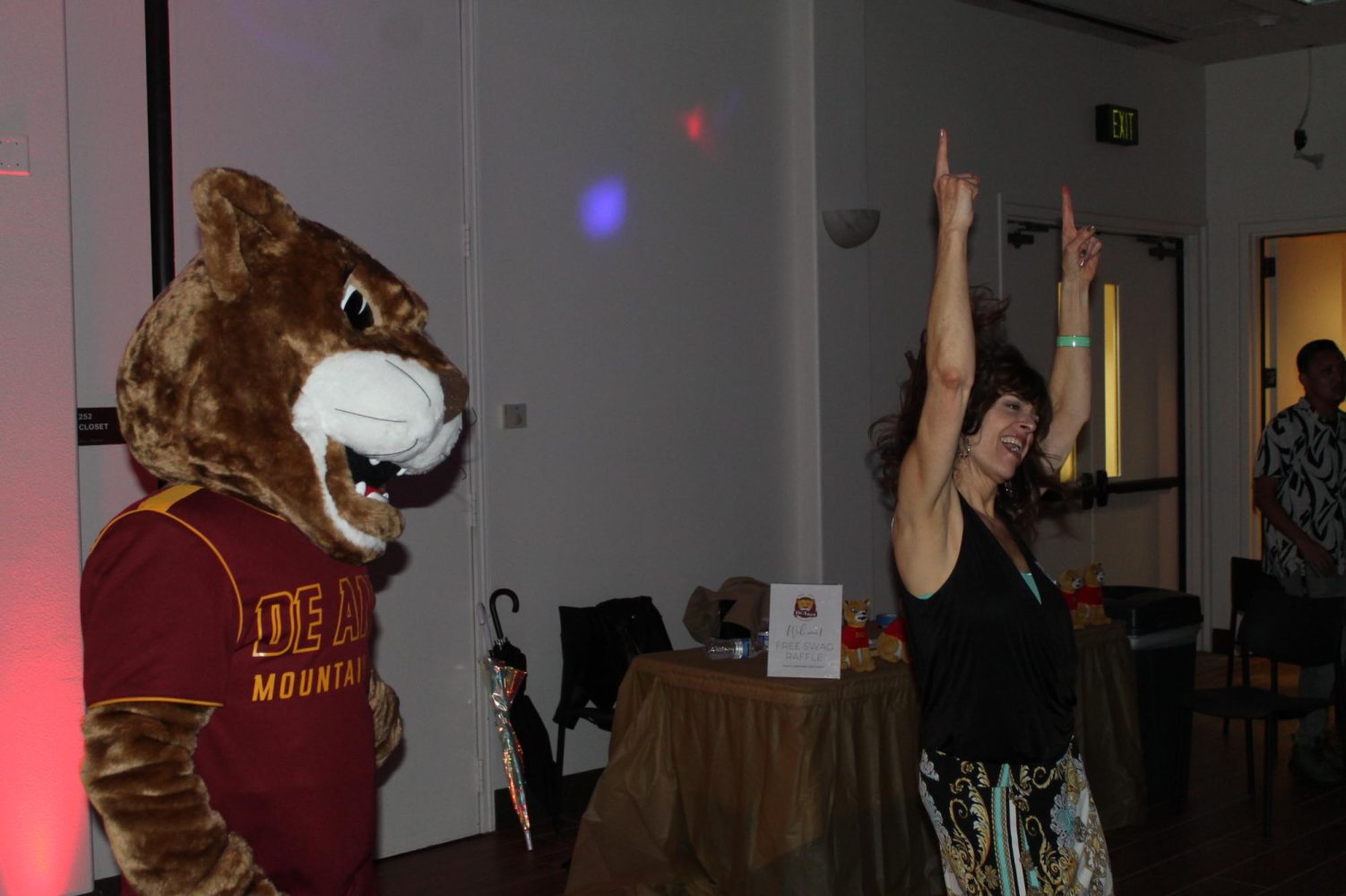 De Anza faculty and new mascot, Roary, on the dance floor at the Homecoming dance on Nov. 17.