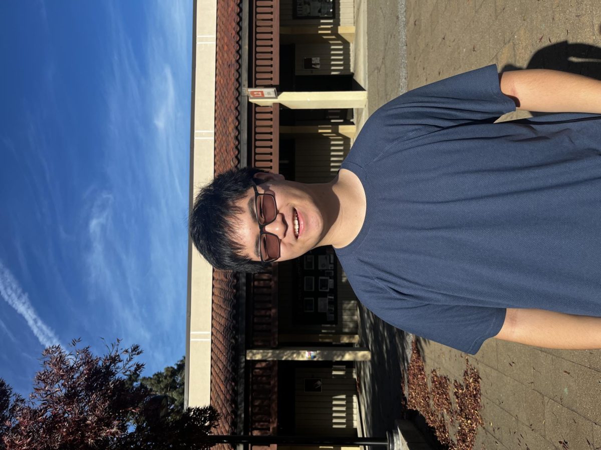 Nickholas Poon, 18, a computer science major, is relaxing in the L Quad on Nov. 14.