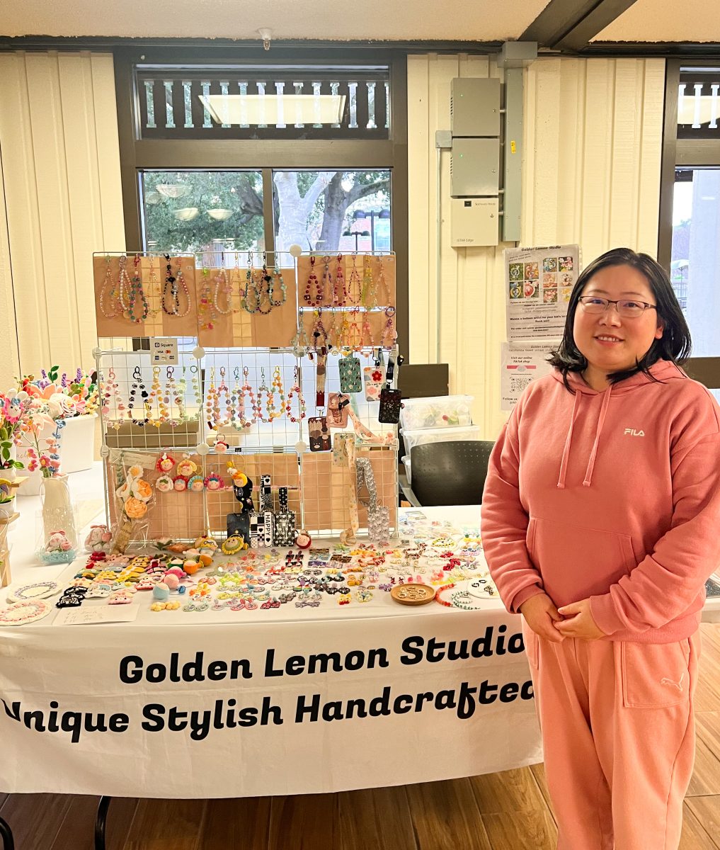 Grace Guo stands at her booth in the Hinson Campus Center.