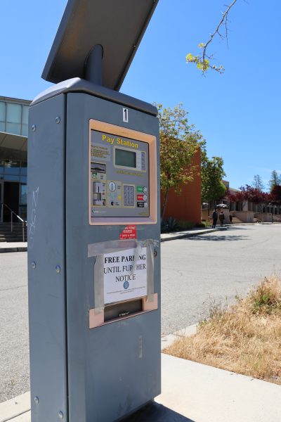 A deactivated parking kiosk longs for the return of its former glory.