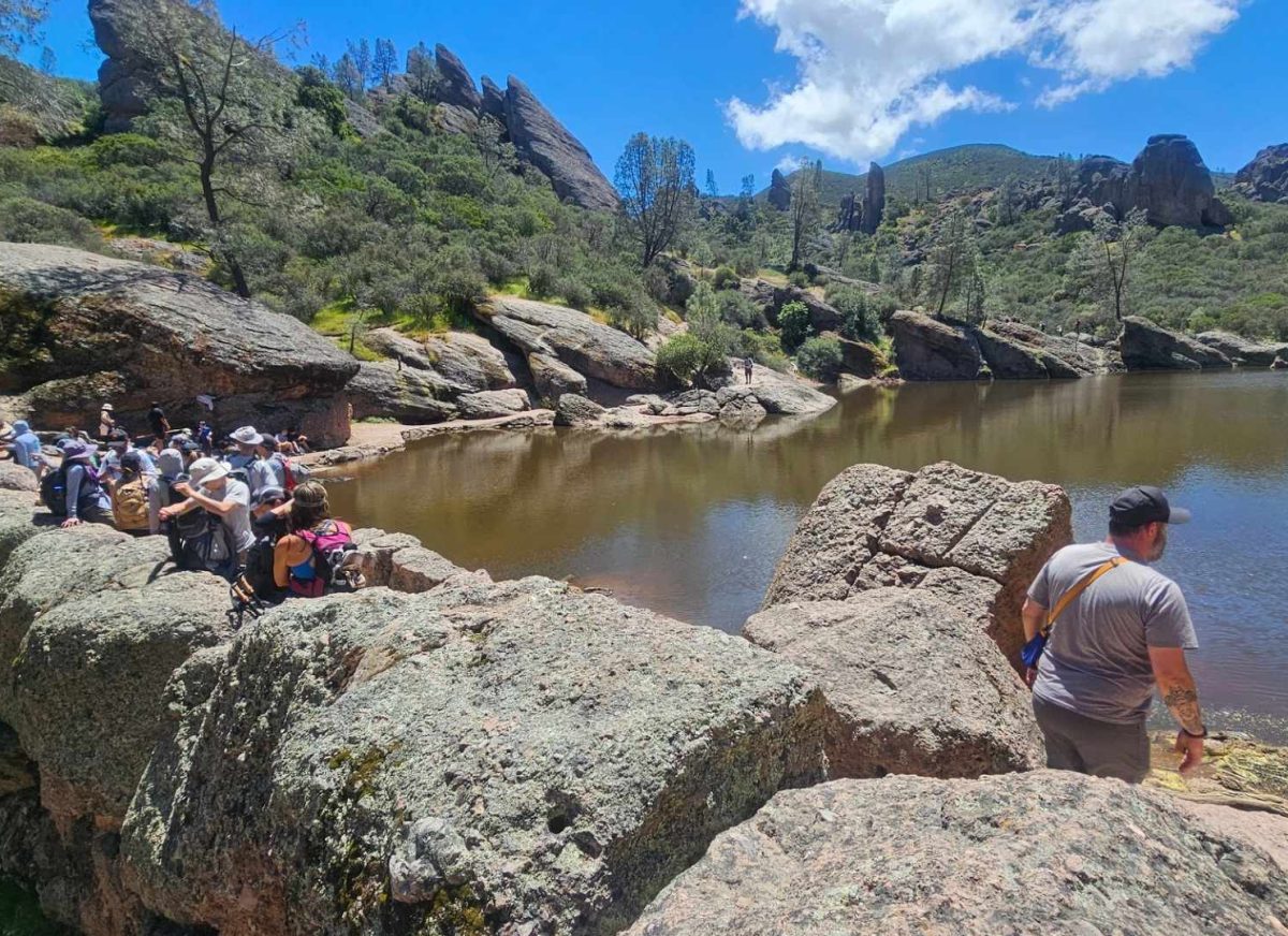 Camie Correa, a surgical technician and a Santa Maria resident, takes a break after a long hike by a group of people at Bear Gulch Lake on April 27.