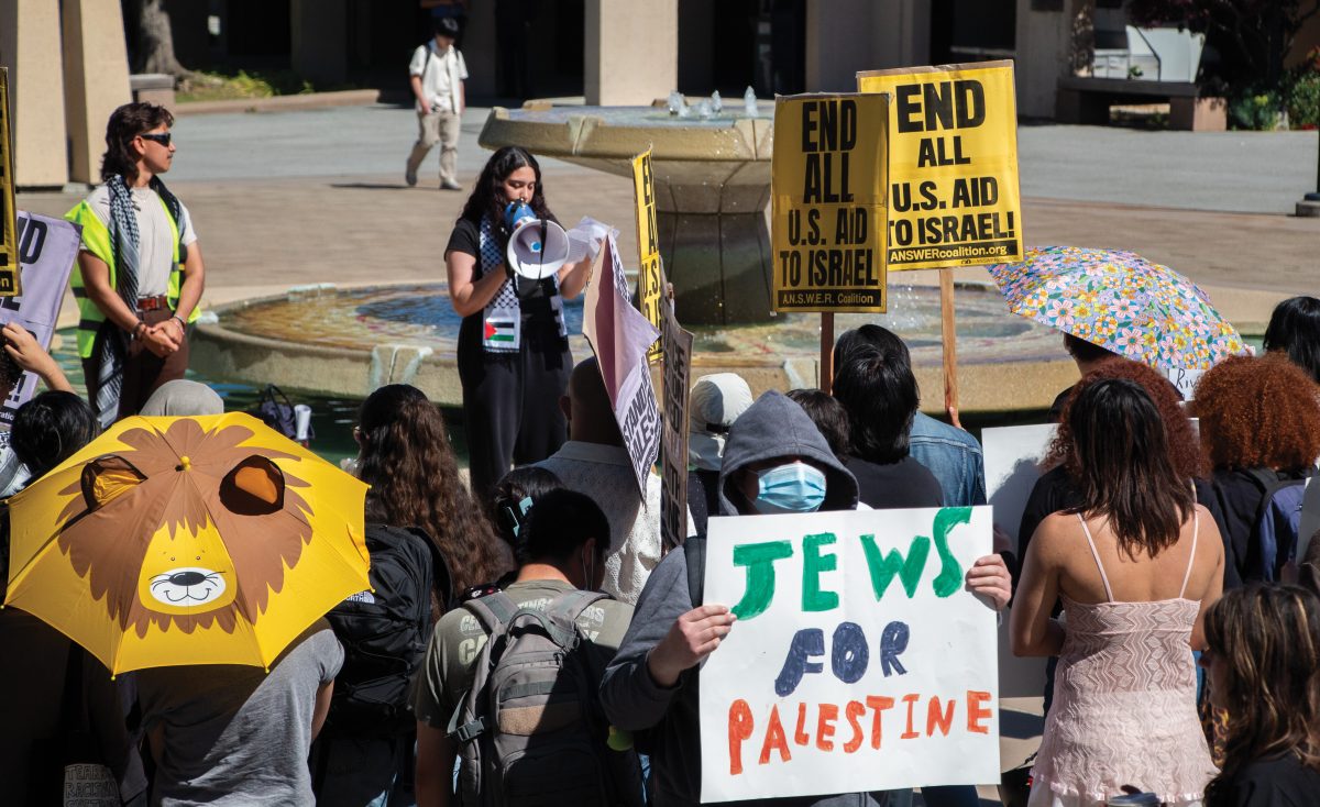 Students+take+part+in+a+walkout+protest+held+in+the+library+quad%2C+calling+for+an+end+to+US+aid+to+Israel+amid+the+ongoing+genocide+in+Gaza+on+May+9.