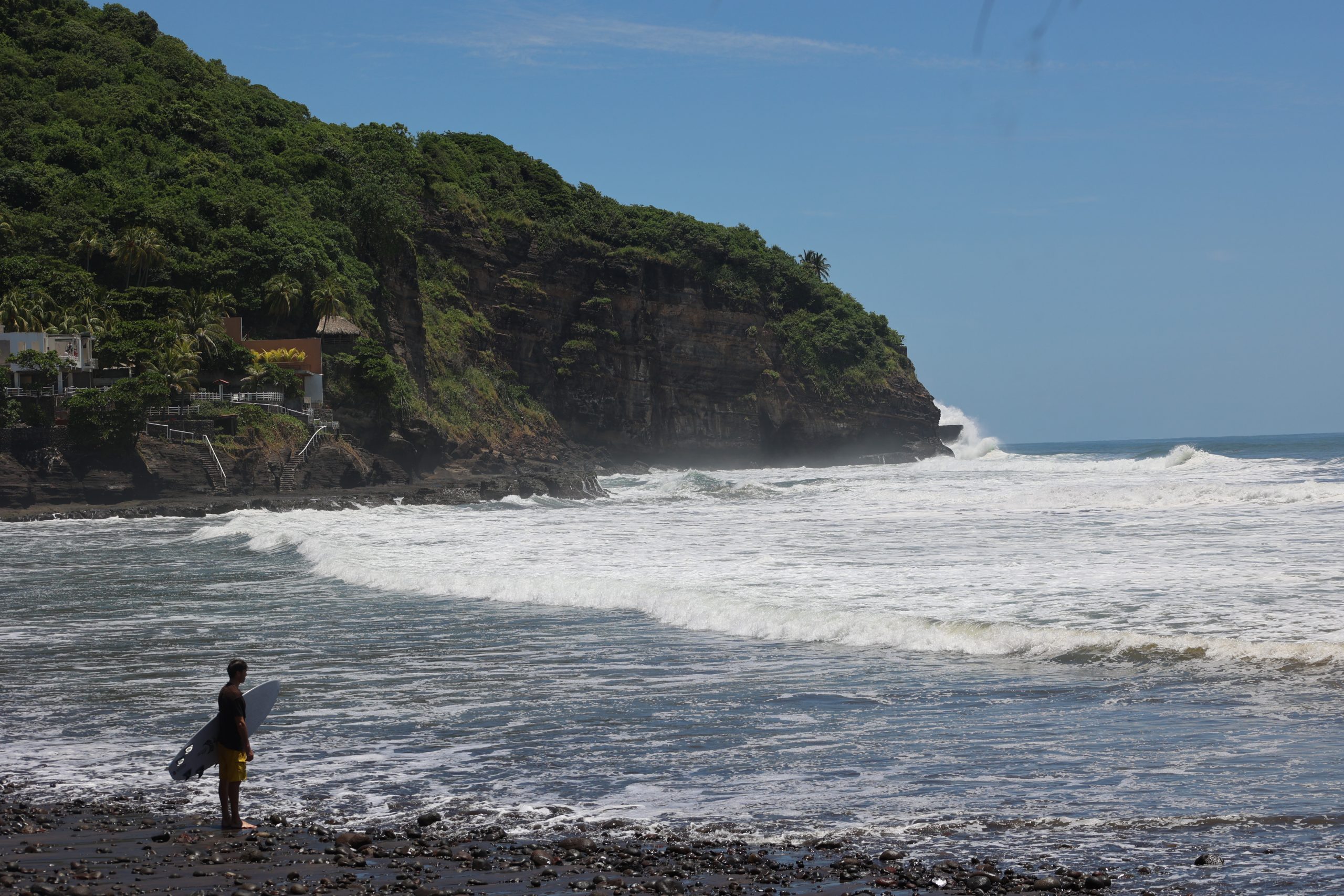 Surfer about to paddle out to sea at Playa El Zonte on May 27.