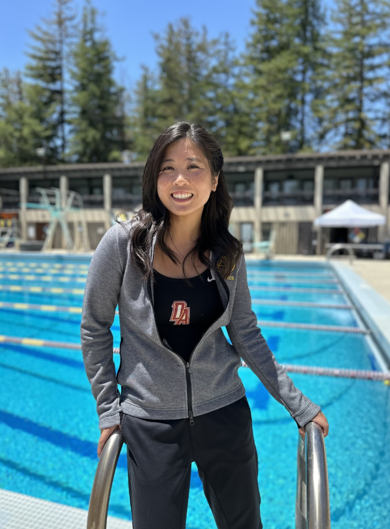 Jacqueline (Jackie) Chan poses for a photo by in front of the pool in the Physical Education quad before the student-athlete awards on