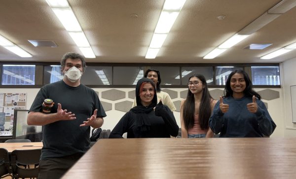 From left, Christopher Deming, faculty advisor, Fenan Feno, 19, biology major, Chetnaa Prasad, 19, biology major and Chemistry Fusion Society officers in the Physical Sciences and Technology Village after their first meeting on June 13.
