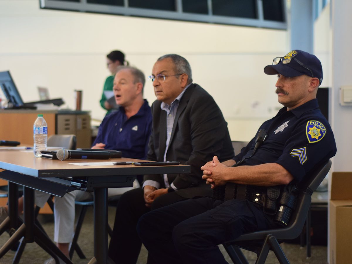 (From right to left) Foothill-De Anza Police Sergeant Shane Lueddeke, Chief Daniel Acosta and Steve Tuttle, a Distinguished TASER Fellow and former Vice President of Strategic Communications at Axon Enterprises address the group of students and community members with Community Relations Officer Joy Garcia in the back at the Media and Learning Center in room MLC 105 on Tuesday, Sept. 17.