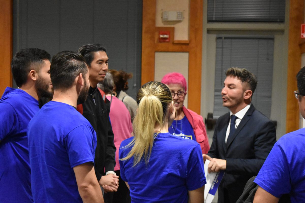 Claudio Bono speaks to his supporters on Oct. 16 at the candidate forum held at the Cupertino Senior Center.